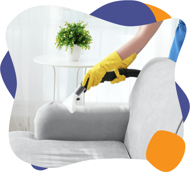 An enviropure home cleaning specialist cleans a sofa with an extractor