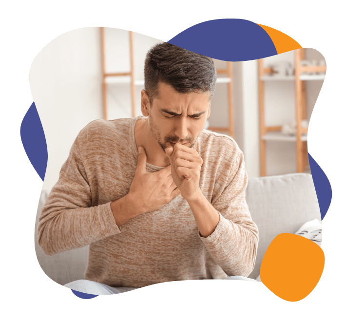 A man coughing as a result of indoor pollutants like dust and pollen